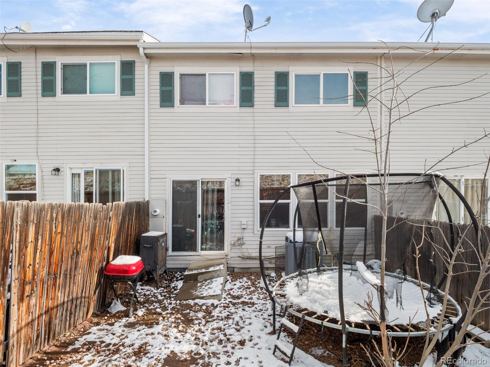 9323 Welby Road Denver, CO 80229 - Photo 29 of 40 a view of a chairs and table in the patio
