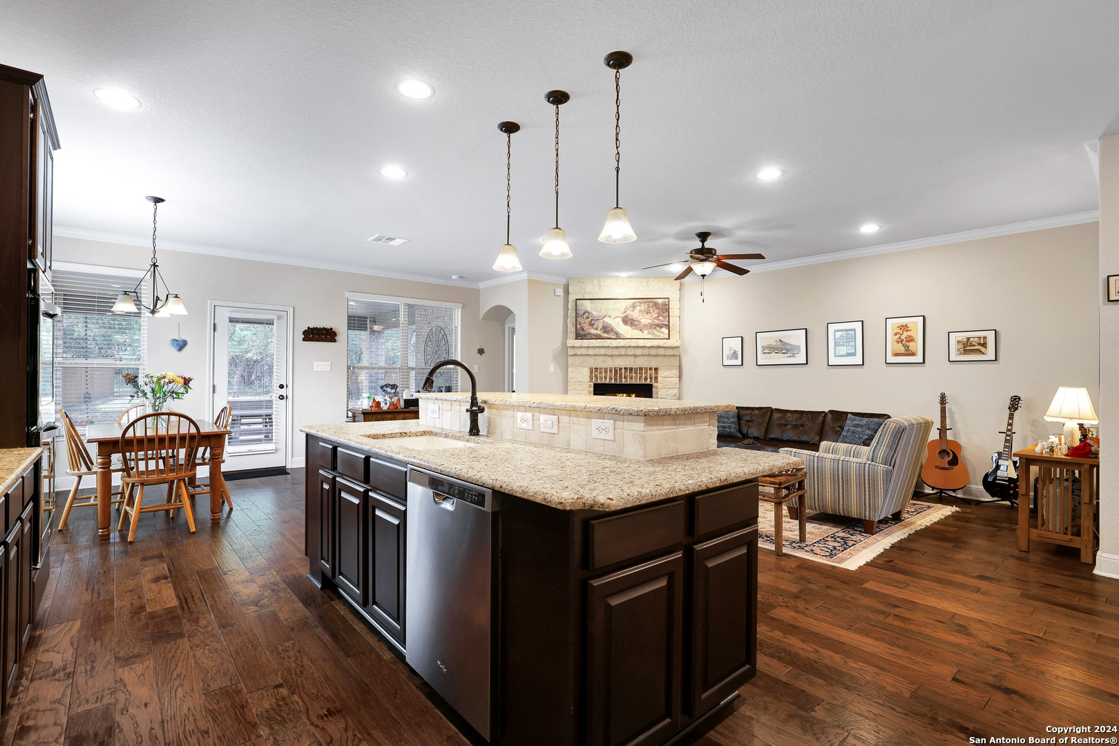 28565 Willis Ranch San Antonio, TX 78260 - Photo 19 of 39 a kitchen with stainless steel appliances granite countertop a stove and a wooden floors