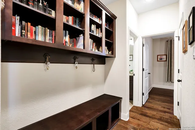a view of a hallway with seating area