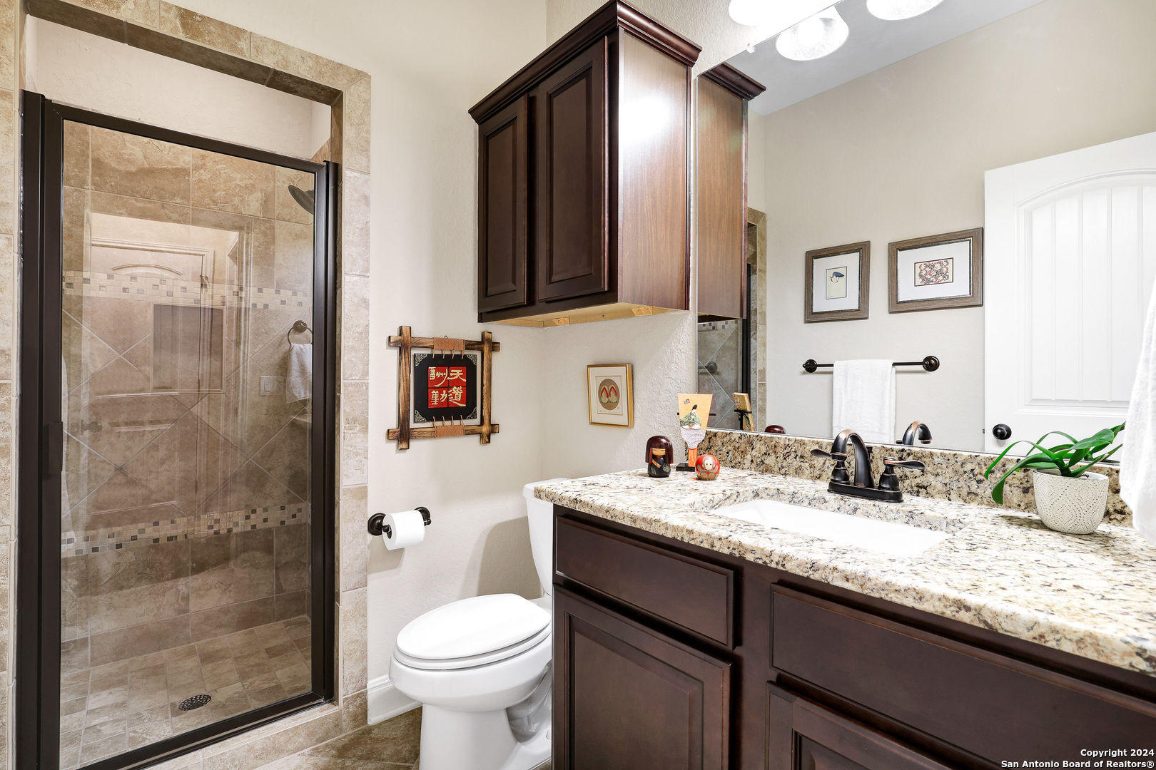 28565 Willis Ranch San Antonio, TX 78260 - Photo 28 of 39 a bathroom with a granite countertop sink toilet and shower