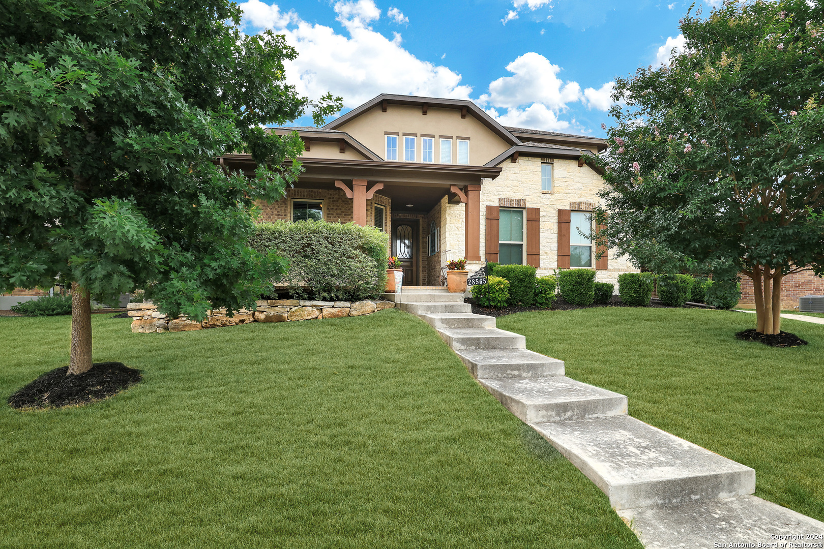 28565 Willis Ranch San Antonio, TX 78260 - Photo 3 of 39 a front view of a house with garden