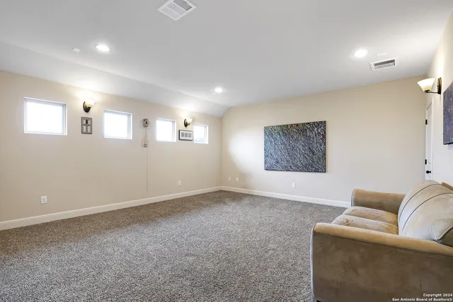 a living room with furniture and a rug