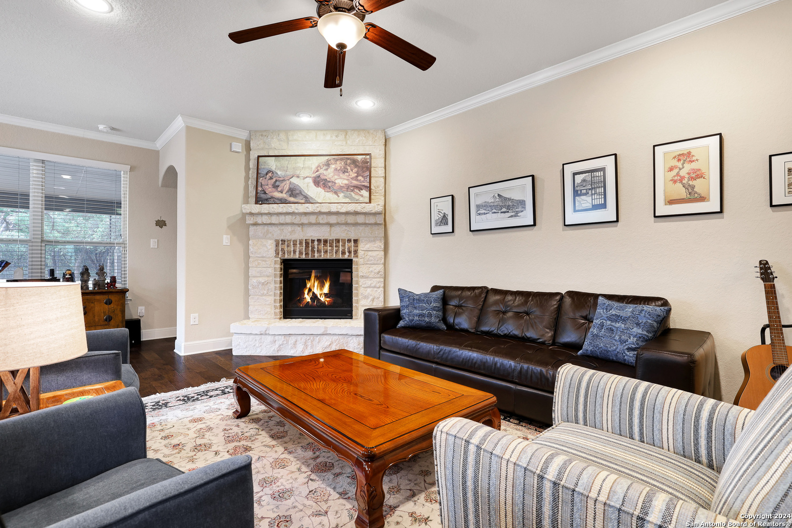 28565 Willis Ranch San Antonio, TX 78260 - Photo 8 of 39 a living room with furniture and a fireplace