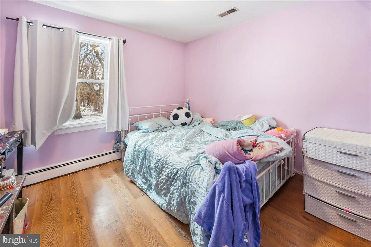 2414 Church Road Cinnaminson, NJ 08077 - Photo 32 of 41 Charming pastel bedroom with cozy vibes.