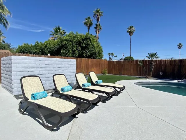 a view of table and chairs in patio