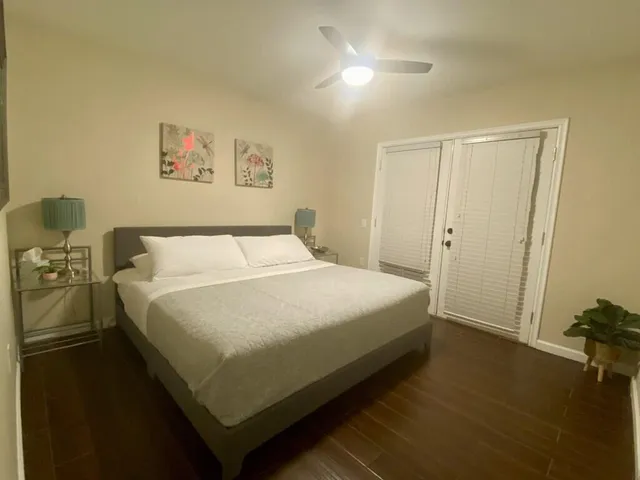 a bedroom with a bed and a table