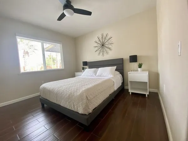 a bedroom with a bed and window