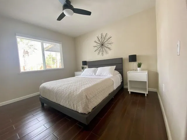 a bedroom with a bed and window