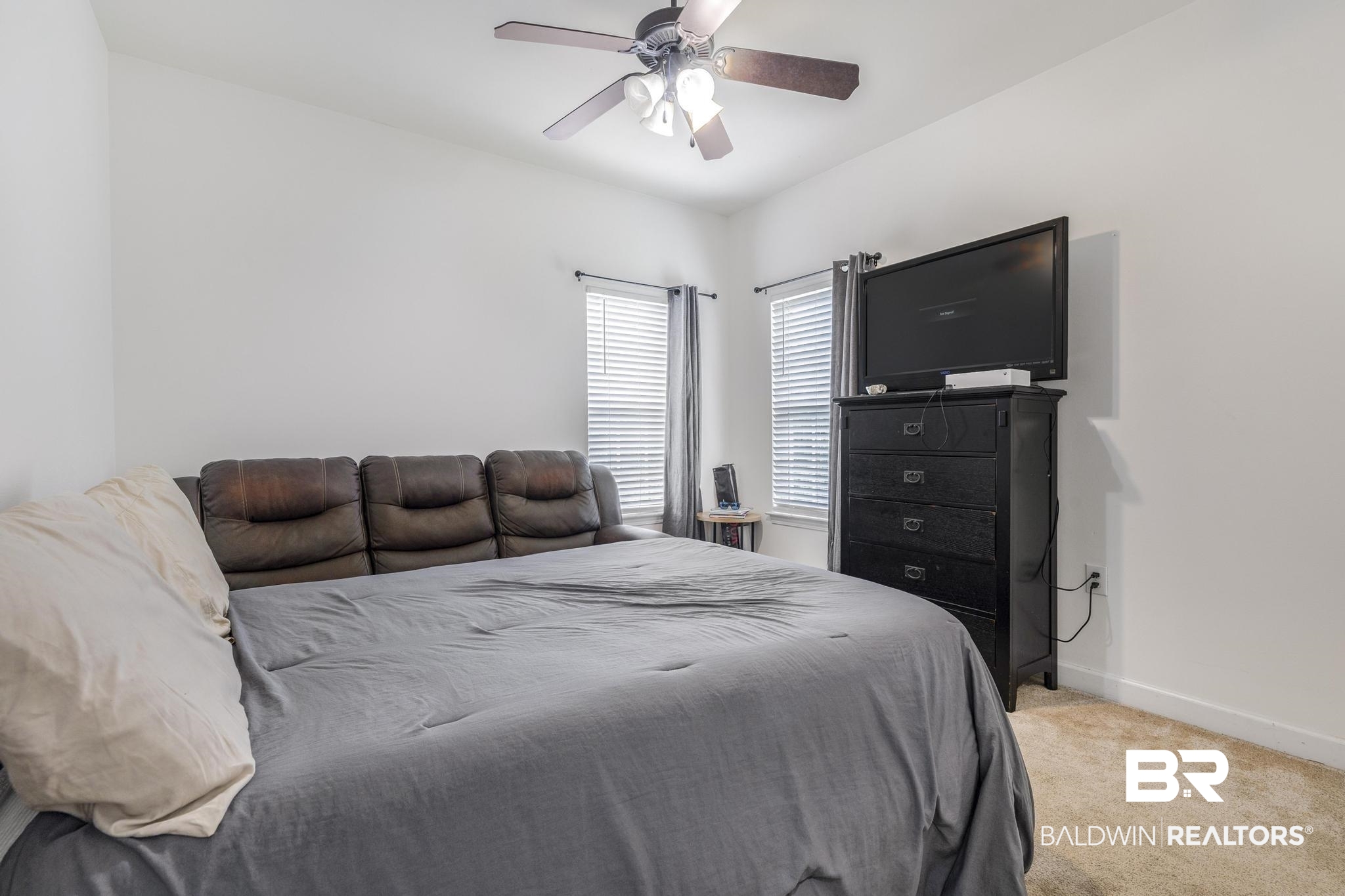 35814 Delvan Lane Bay Minette, AL 36507 - Photo 30 of 53 Comfortable bedroom featuring light neutral wall tones, carpet flooring, a ceiling fan with integrated lighting, and dual windows equipped with blinds