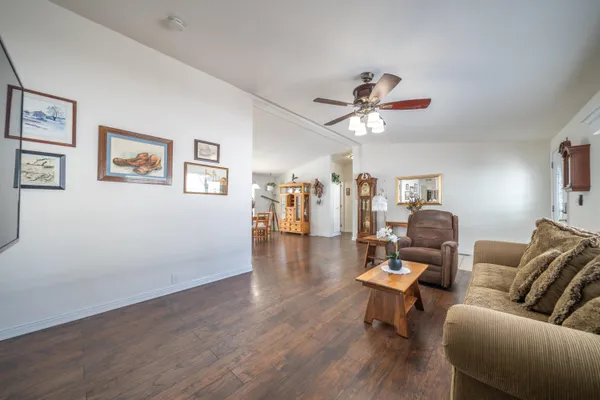 a view of a dining room with furniture window and wooden floor