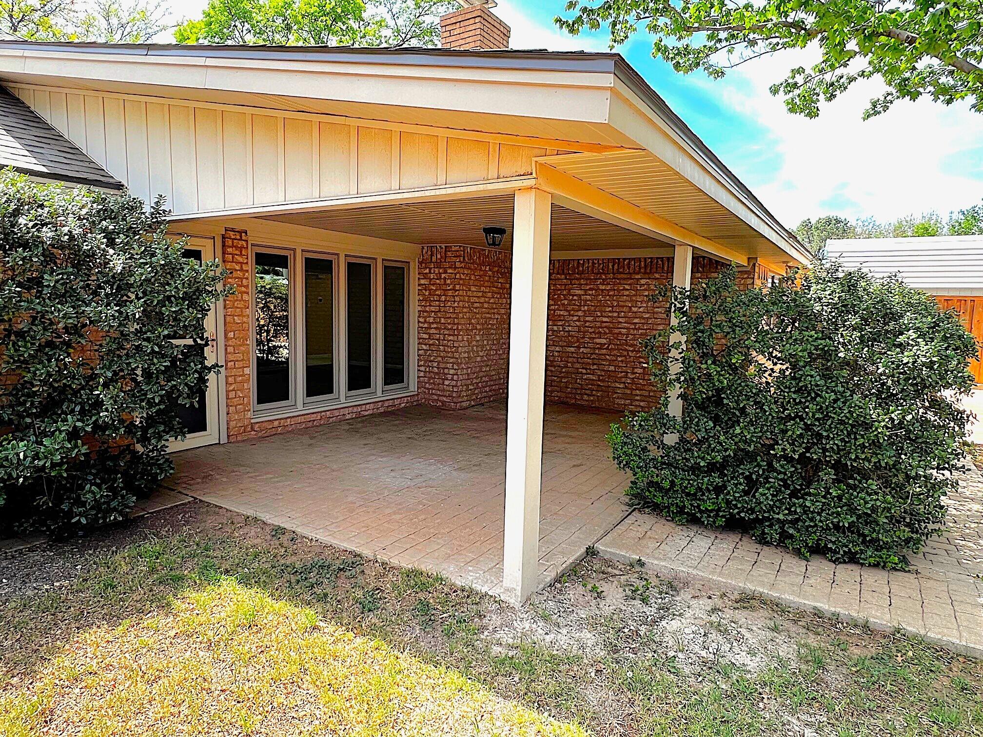 3506 86th Street Lubbock, TX 79423 - Photo 24 of 29 a view of a house with potted plants