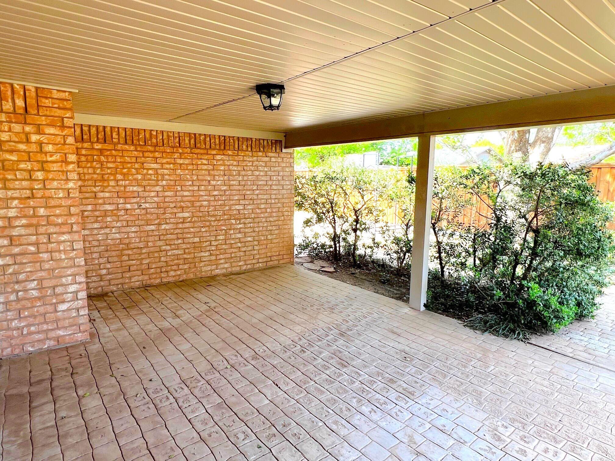 3506 86th Street Lubbock, TX 79423 - Photo 27 of 29 a view of a porch with wooden floor