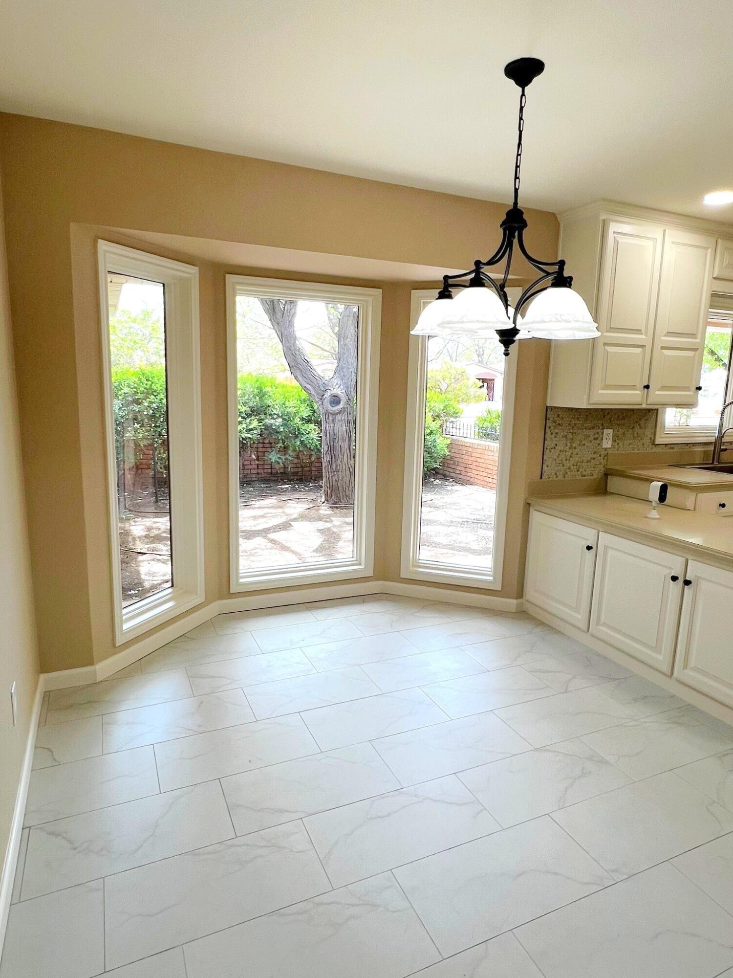 3506 86th Street Lubbock, TX 79423 - Photo 7 of 29 a view of an empty room with a window