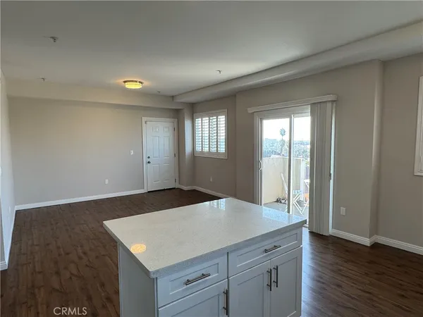 an empty room with wooden floor