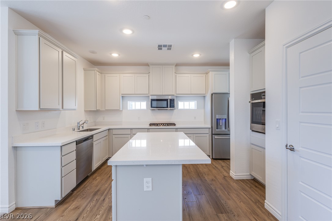 2555 Hampton Road, Unit 8206 Henderson, NV 89052 - Photo 9 of 25 A pristine kitchen boasting modern appliances and generous counter space for culinary endeavors.