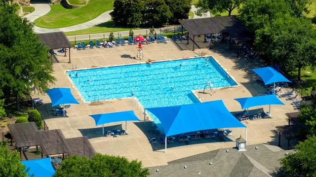 an aerial view of multiple houses with yard