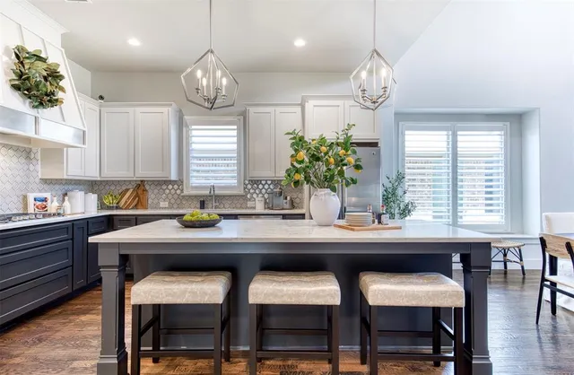 a kitchen with a table and chairs in it