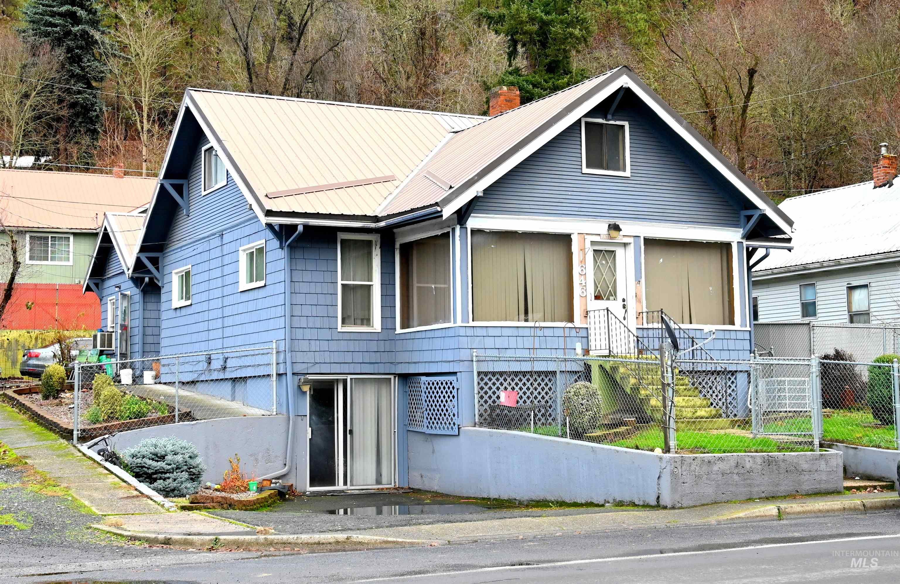 646 Riverside Avenue Orofino, ID 83544 - Photo 19 of 23 View of front of house featuring a metal roof and a chimney