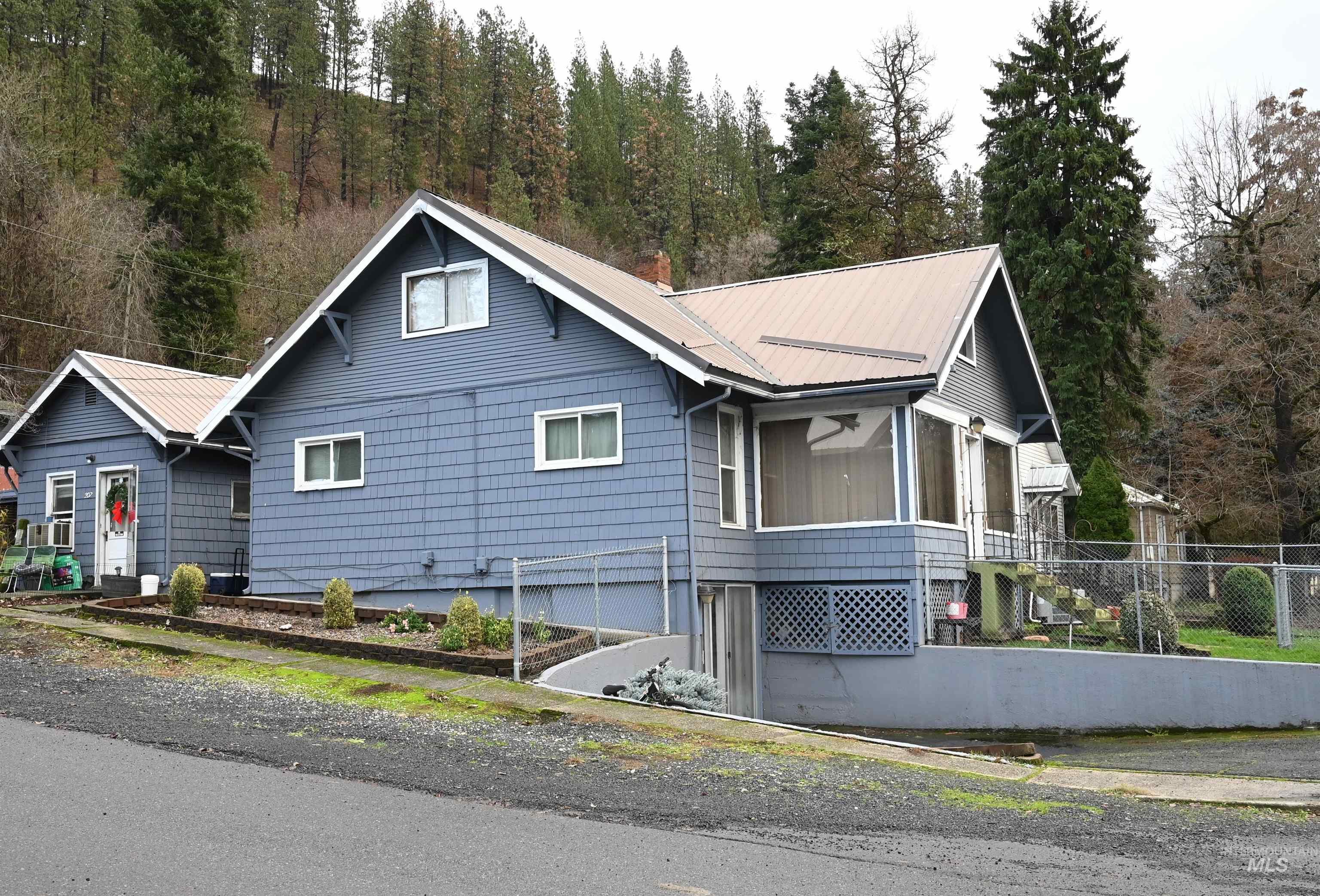 646 Riverside Avenue Orofino, ID 83544 - Photo 20 of 23 View of home's exterior featuring a metal roof
