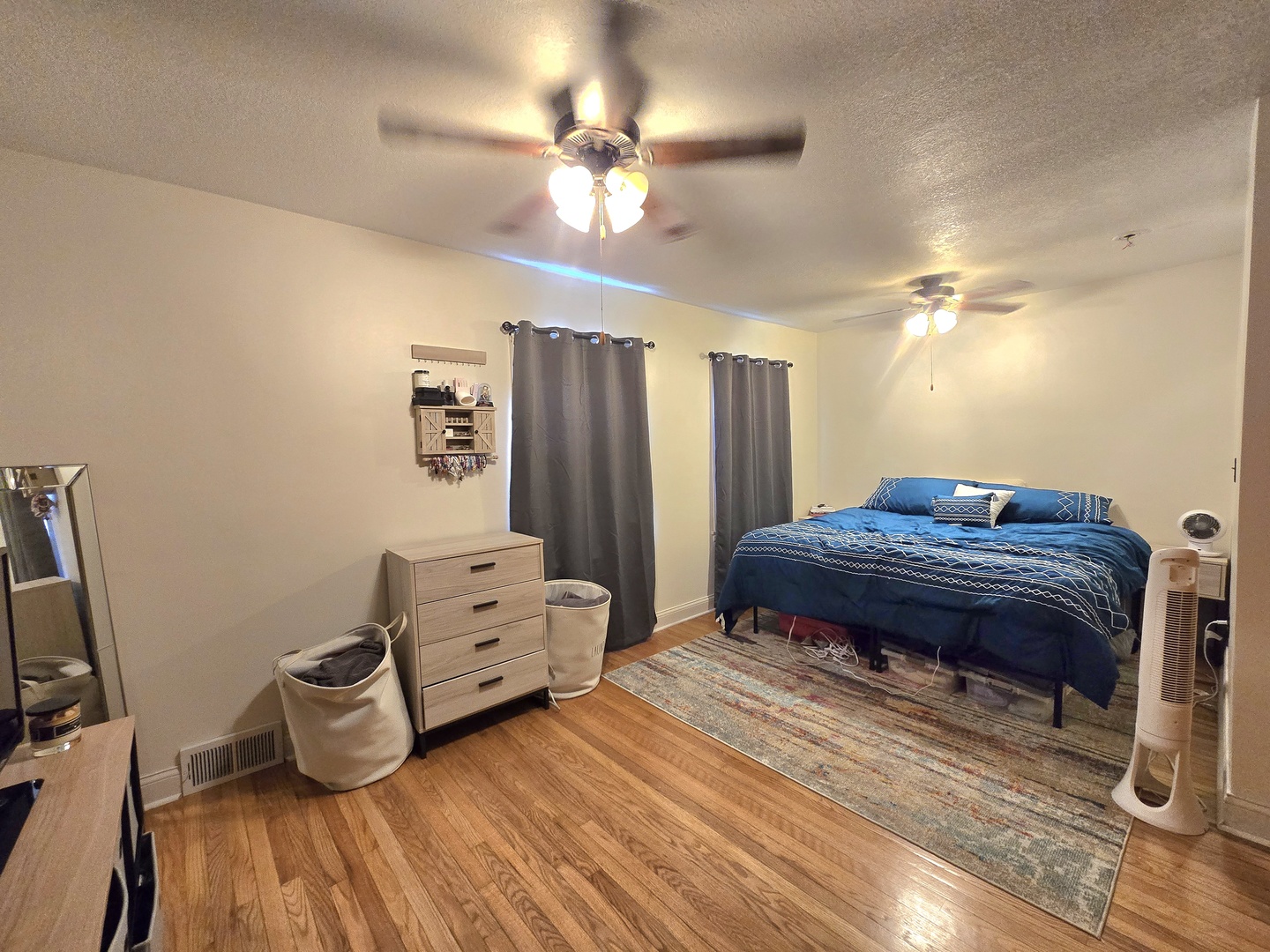 255 South Fourth Street Clifton, IL 60927 - Photo 14 of 34 a bedroom with a bed and a chandelier