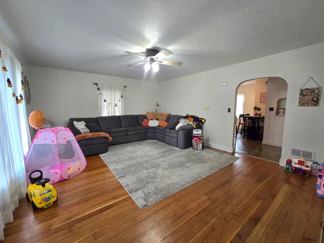 a bedroom with furniture and a chandelier