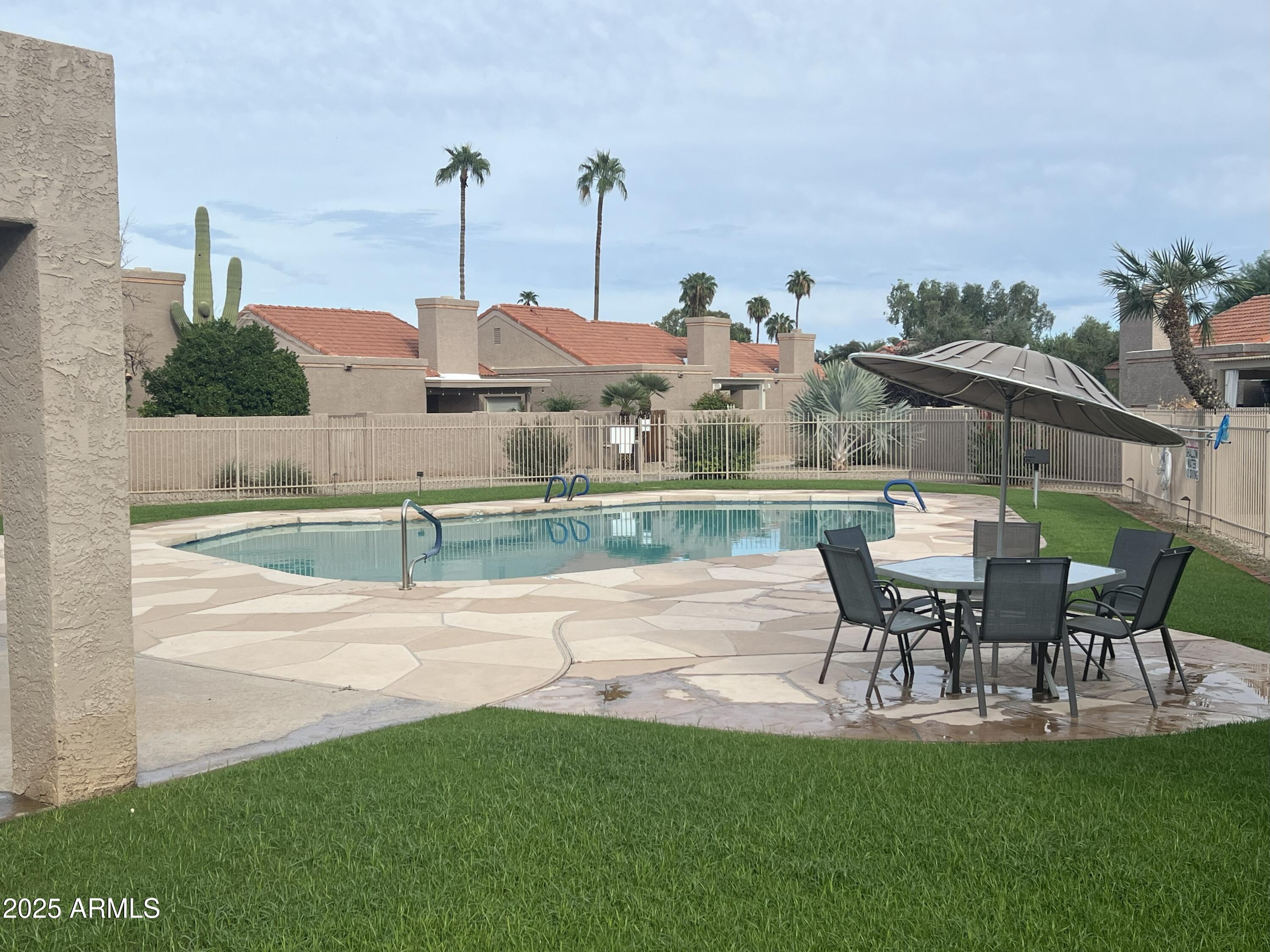 4011 East Charter Oak Road Phoenix, AZ 85032 - Photo 22 of 31 a view of a house with a yard and sitting area