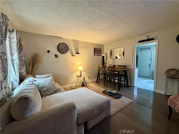 a bedroom with furniture and wooden floor