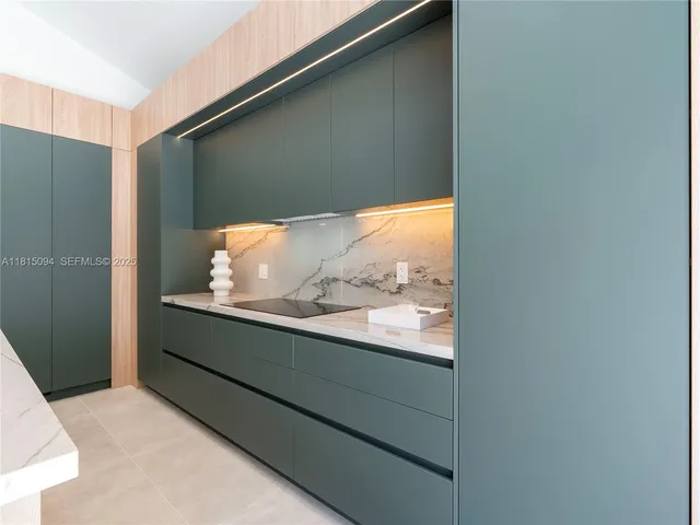 a room with a large window and mirror