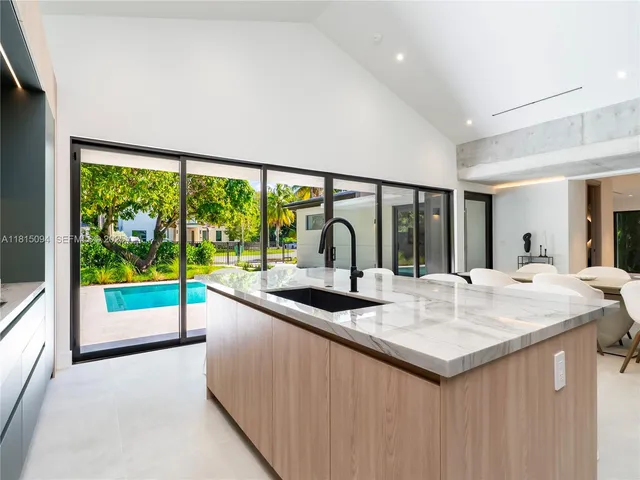 a kitchen with a sink and a large window