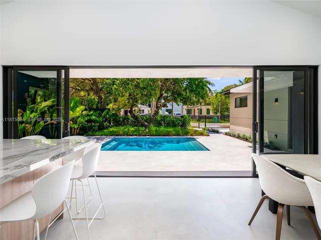 a white bench sitting in front of a building