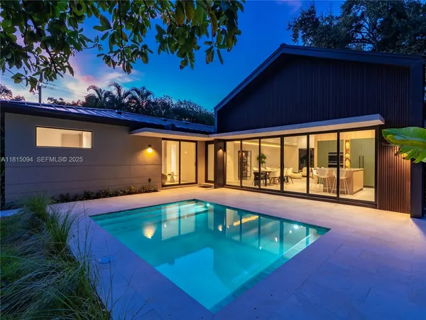 a view of a swimming pool with an outdoor seating