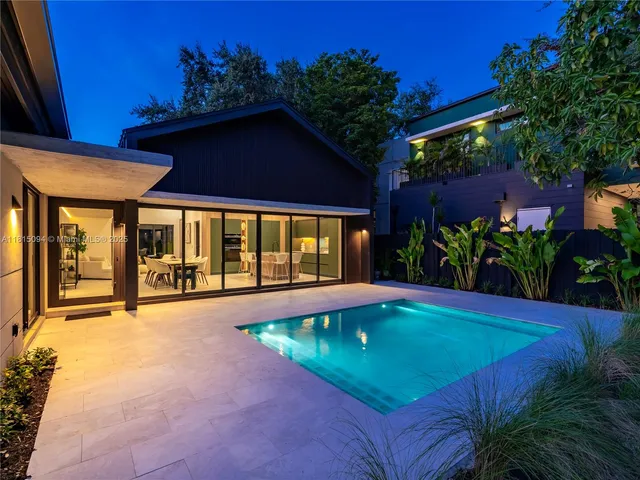 a view of pool with a yard