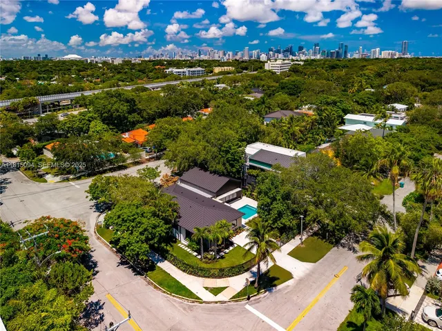 an aerial view of house with a yard