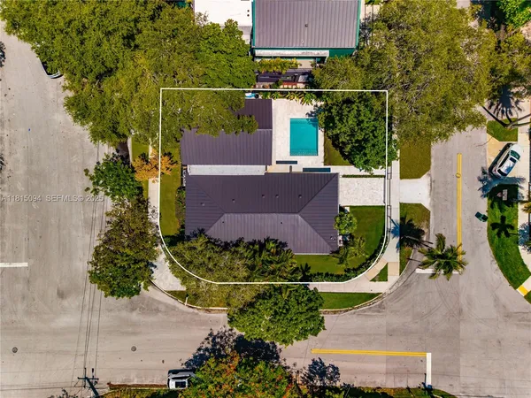 a view of a house with a yard and sitting area