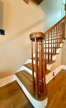a view of a room with wooden floor and chair