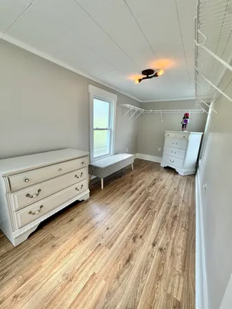 a view of a living room with a wooden floor