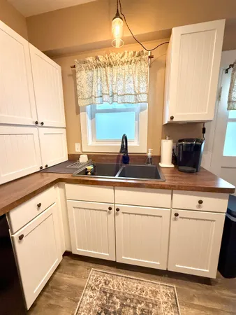 a kitchen with a sink and cabinets