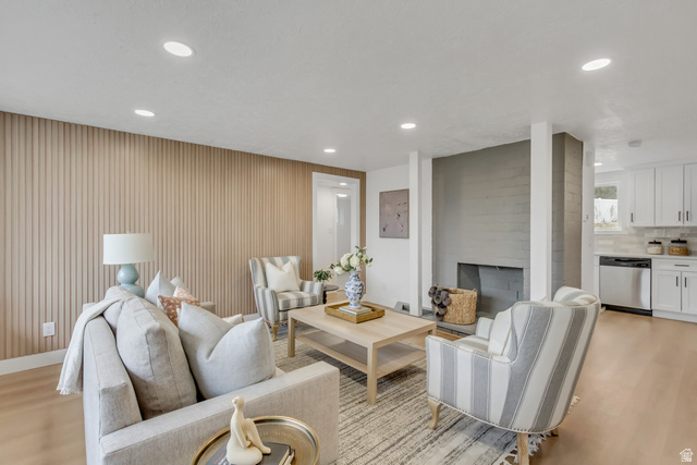 337 West 2900th Street South Bountiful, UT 84010 - Photo 4 of 35 Living area featuring light wood finished floors, a fireplace, and recessed lighting
