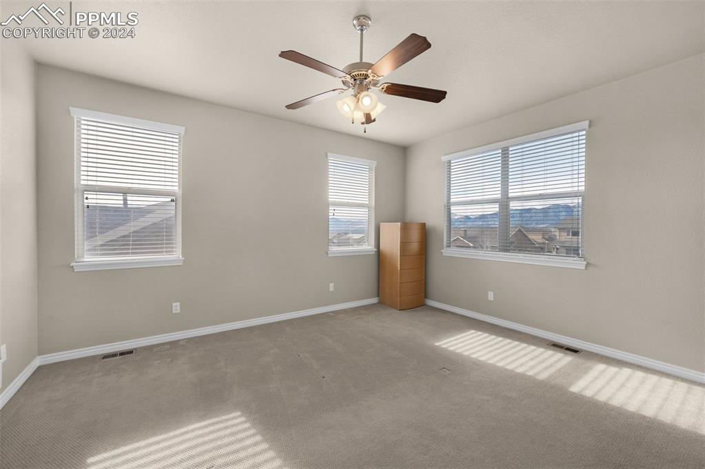 1053 Crystal Basin Drive Colorado Springs, CO 80921 - Photo 26 of 49 a view of an empty room with a window