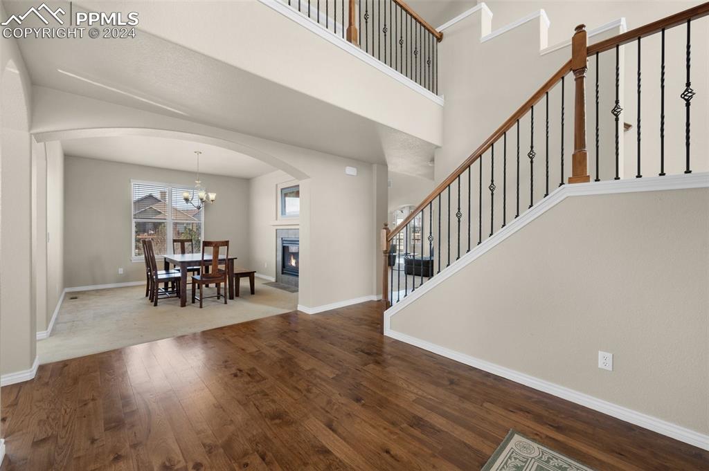 1053 Crystal Basin Drive Colorado Springs, CO 80921 - Photo 4 of 49 a view of dining room with wooden floor and stairs