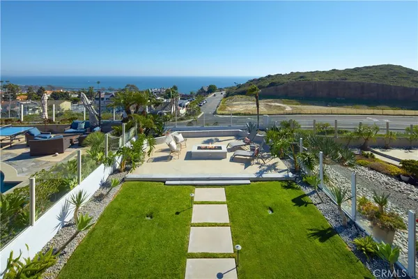 a view of a swimming pool with a yard
