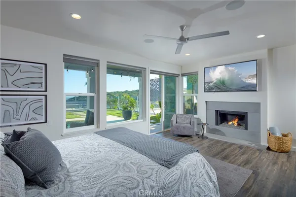a bedroom with a bed and a fireplace