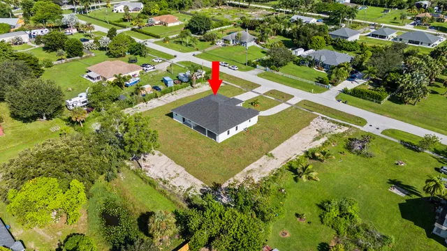 a kitchen with stainless steel appliances kitchen island granite countertop a sink a refrigerator and a stove