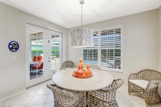 a dining room with a table and chairs