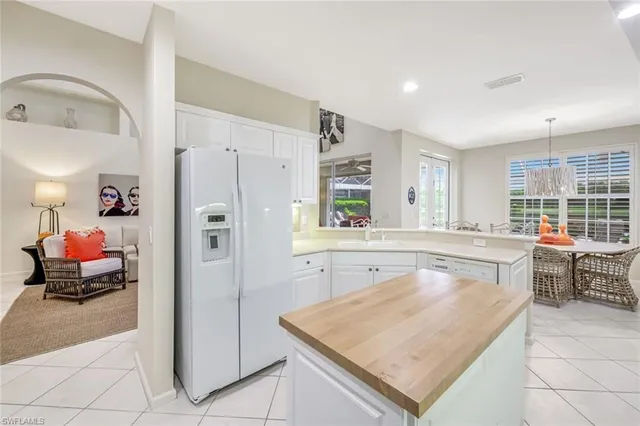a kitchen with a stove a refrigerator and a sink