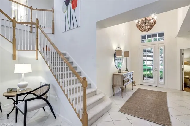 a view of entryway with wooden floor and a front door