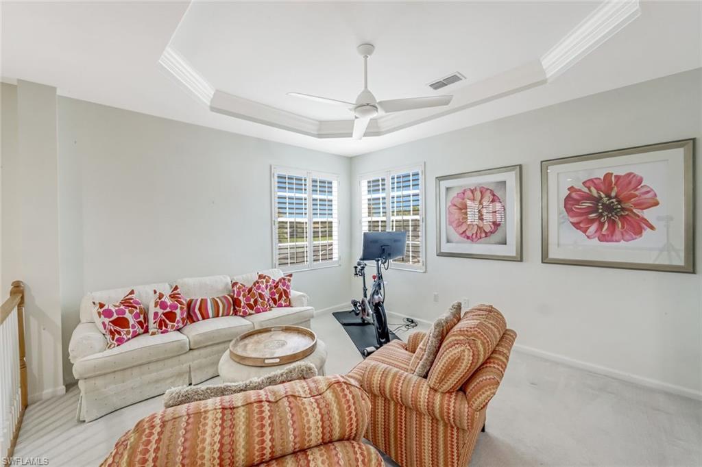 23045 Tree Crest Court Estero, FL 34135 - Photo 24 of 46 Versatile Loft Space with intricate ceiling detail, plantation shutters and plush carpet.