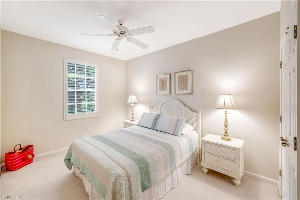 23045 Tree Crest Court Estero, FL 34135 - Photo 28 of 46 Guest Bedroom #2 featuring plantation shutters, plush carpet, baseboards and ceiling fan