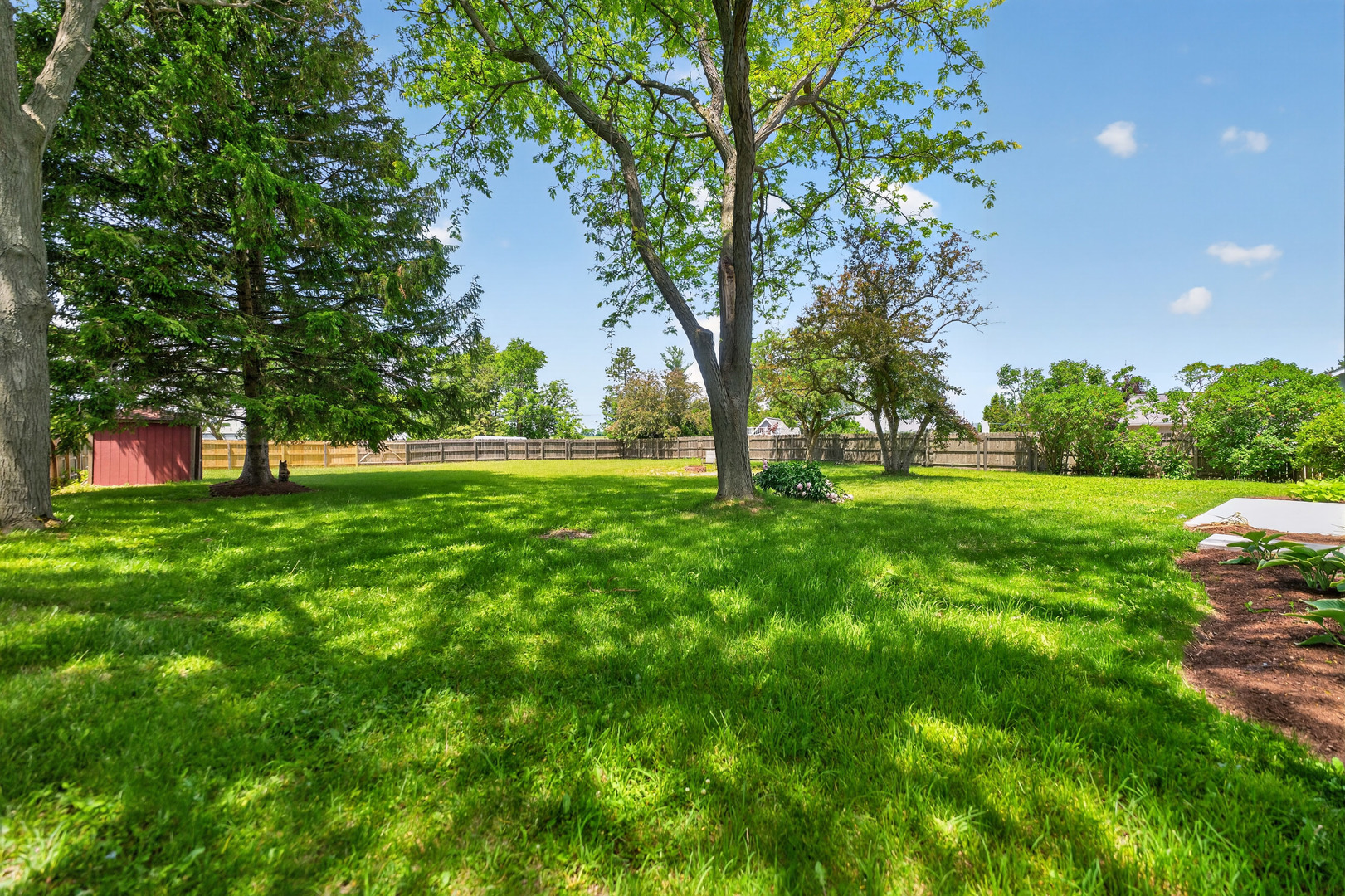 9 Jennifer Lane DeKalb, IL 60115 - Photo 11 of 16 a view of green field with trees in the background