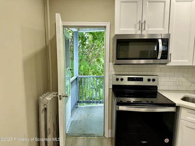 a kitchen with a stove and a microwave